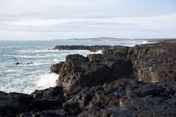 Photo of Big waves crashing in rocks on the south west coast on Iceland