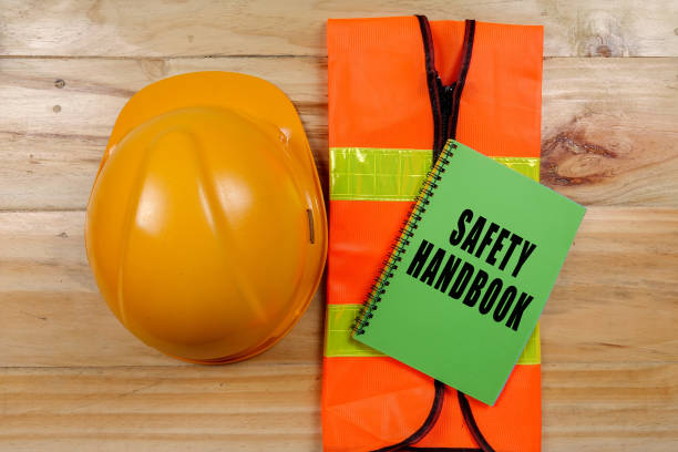 istock HEALTH,SAFETY & ENVIRONMENT CONCEPTUAL with general texts and standard construction safety equipment. 1198613917
