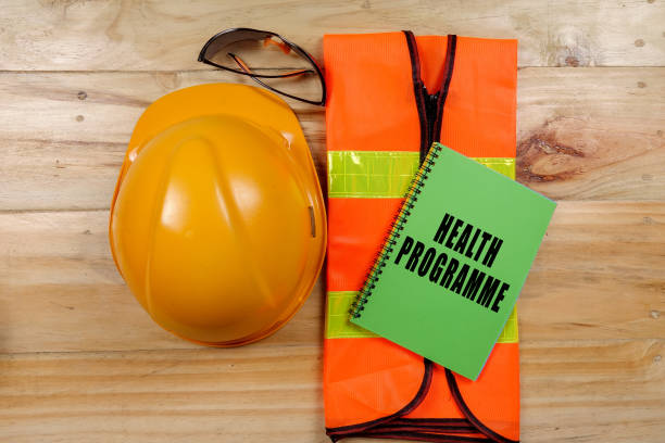 istock HEALTH,SAFETY & ENVIRONMENT CONCEPTUAL with general texts and standard construction safety equipment. 1198613939