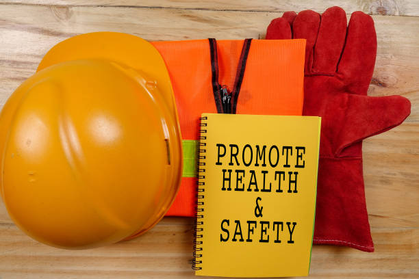 istock HEALTH,SAFETY & ENVIRONMENT CONCEPTUAL with general texts and standard construction safety equipment. 1198613957