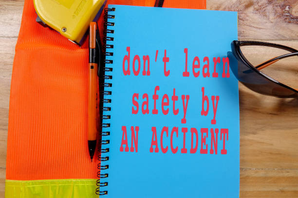 istock HEALTH,SAFETY & ENVIRONMENT CONCEPTUAL with general texts and standard construction safety equipment. 1198613972