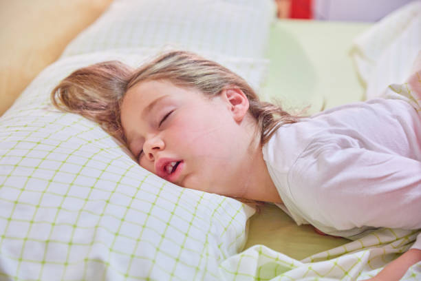 istock funny face of girl sleeping on king bed 1198614092