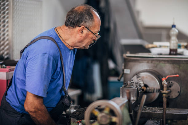 istock Senior man working in metal factory 1198614775
