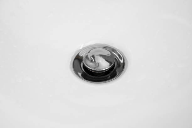 istock Bathroom interior with white round sink and chrome faucet in a modern bathroom. 1198614905