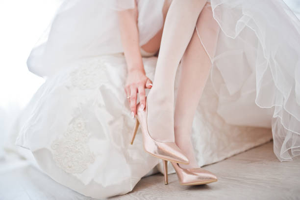 istock Elegant white wedding shoes at bride morning. 1198616848