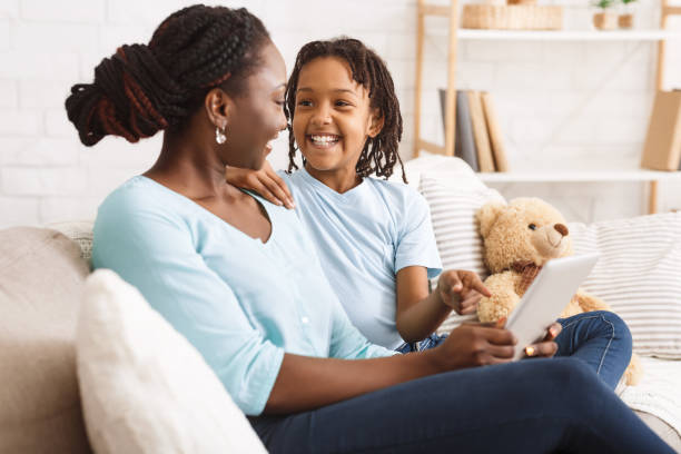 istock Happy afro family spending time together at home 1198617157