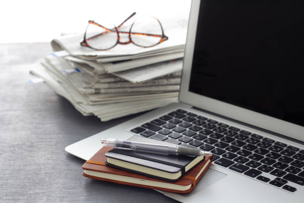istock Glasses, real newspaper and laptop 1198617269