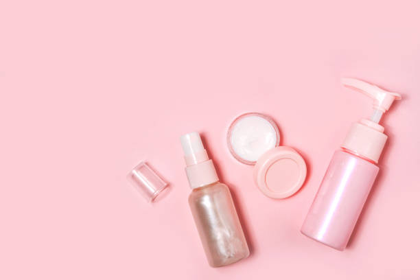 istock Cosmetic bottle containers on pink color background. 1198619123