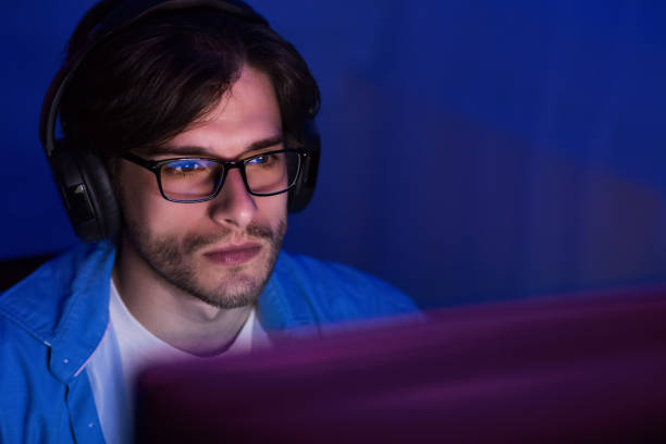 istock Pro gamer playing video game wearing headset 1198620334