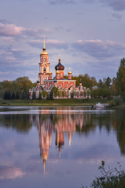 istock Resurrection Cathedral in Staraya Russa is reflected in the river. Spring landscape. 1198621423