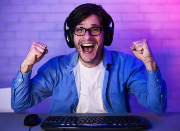 istock Professional gamer playing and winning shooter online game 1198622683