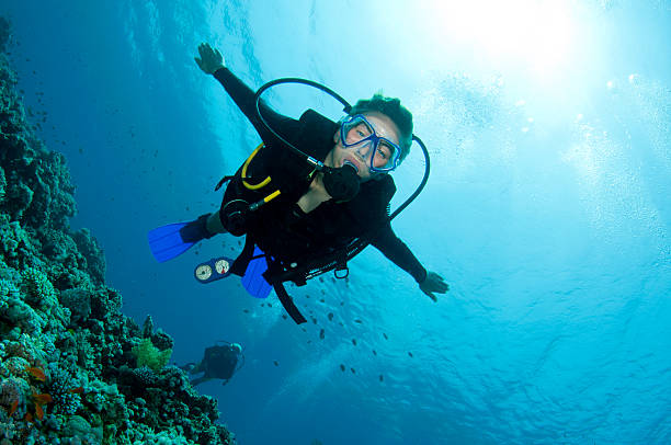istock scuba diver swims to the camera 119862322