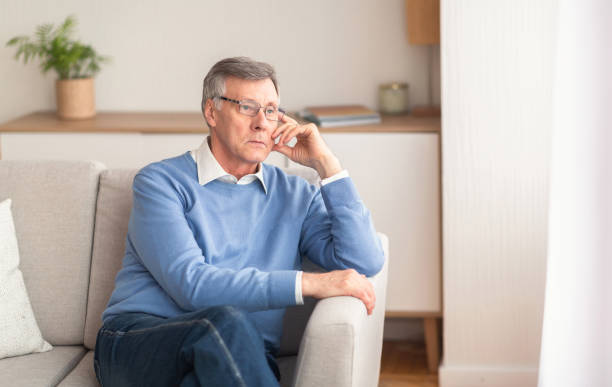 istock Senior Man Thinking About Retirement Sitting On Couch At Home 1198624976