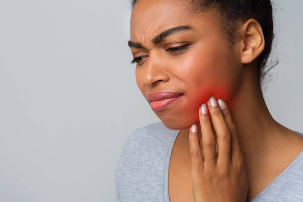 istock Young sad girl having pain in her teeth 1198629448