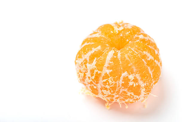istock Peeled mandarin orange on white background 1198630509