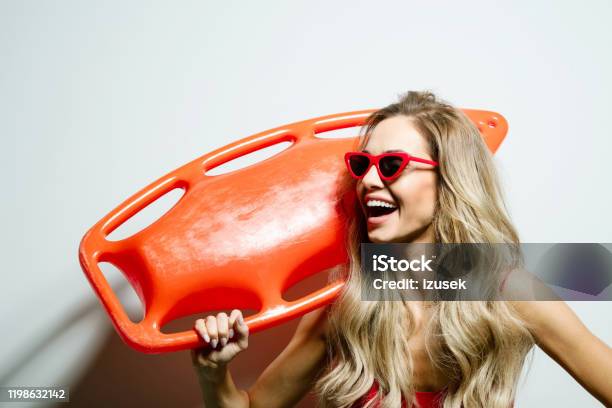 Summer Portrait Of Young Woman Holding Rescue Buoy Stock Photo - Download Image Now - 25-29 Years, Adult, Adults Only