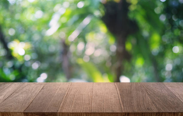 istock Empty dark wooden table in front of abstract blurred bokeh background of restaurant . can be used for display or montage your products.Mock up for space. 1198632485