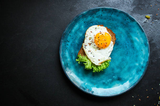 istock fried eggs, healthy food (delicious snack) menu concept. food background. top view. copy space 1198632800
