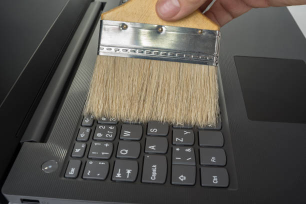 istock Clean keyboard with a wide brush from dust. 1198634889