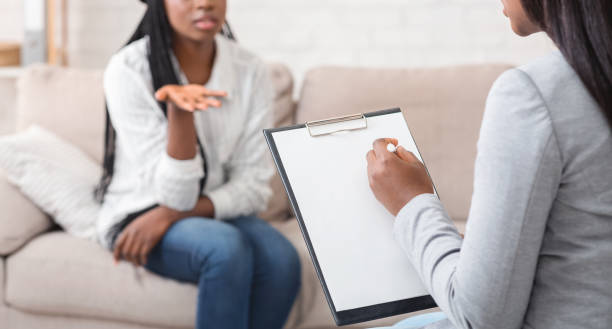istock Psychologist having therapy session with her patient in office 1198634957