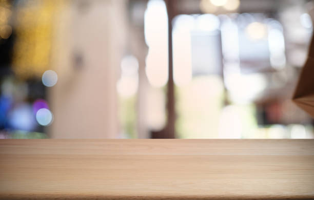 istock Empty dark wooden table in front of abstract blurred bokeh background of restaurant . can be used for display or montage your products.Mock up for space. 1198635155