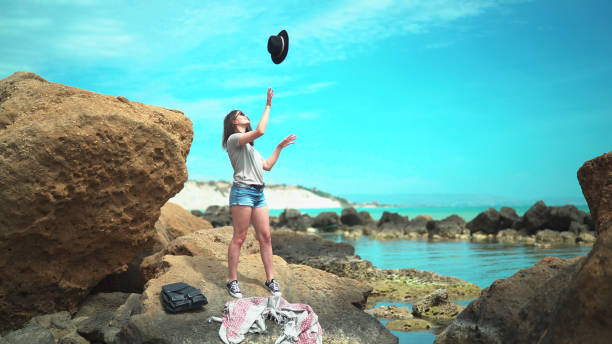 Girl fooling around on the beach