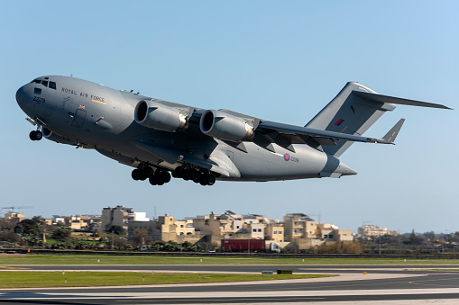 Luqa, Malta - January 10, 2020: Royal Air Force Boeing C-17A Globemaster III (REG: ZZ178) lifting off from runway 31 after an overnight fuel stop.