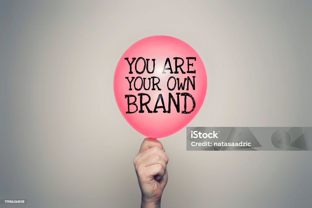 You are your own brand You are your own brand balloon in hand Advertisement Stock Photo