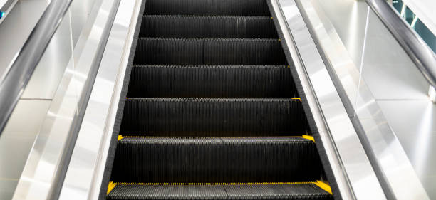 istock Ditry stairs on Escalator with yellow strips. 1198638217