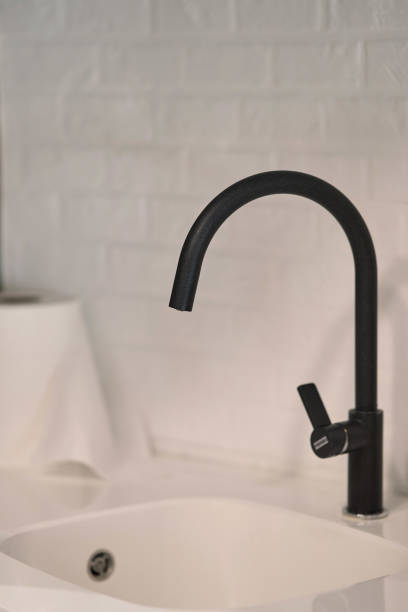 istock Modern black faucet. Close-up. Bathroom interior details. 1198639040