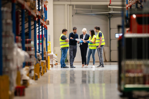 istock Warehouse staff meeting, workers with mnagers 1198639744