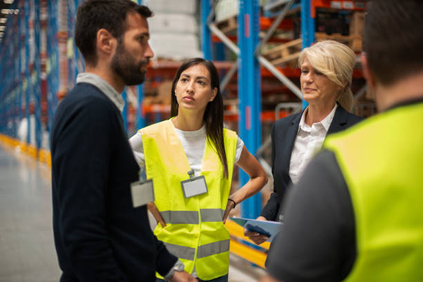 istock Warehouse staff meeting, workers with mnagers 1198639759