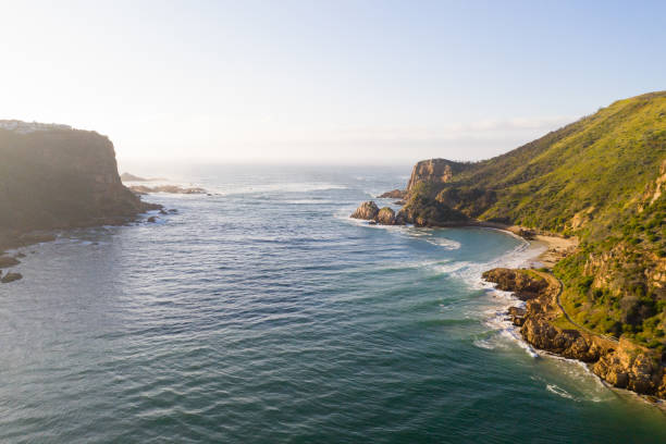 View through the Knysna Heads View over the famous Knysna Heads in South Africa. Ocean inlet into a large Estuary. Horizon over water george south africa stock pictures, royalty-free photos & images