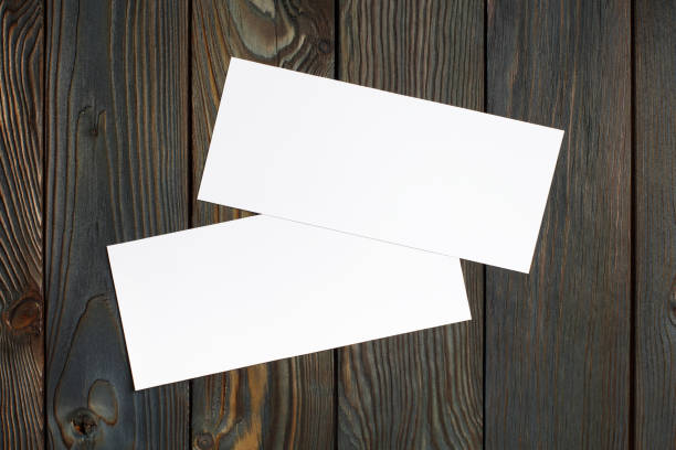 istock Two blank cards or papers on wood 1198640241