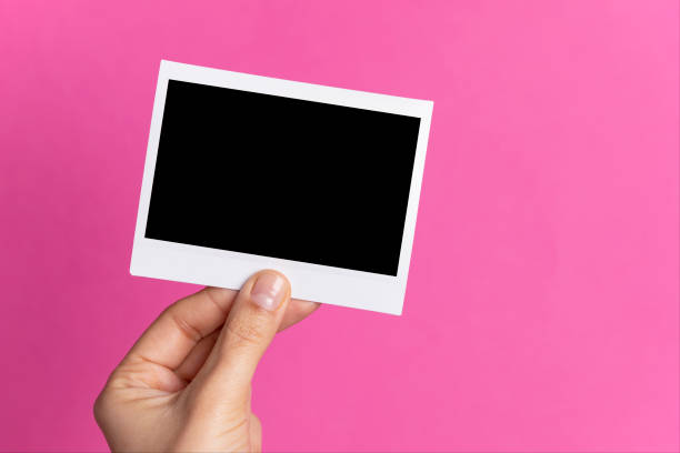 istock Hand Holding Instant Photo 1198640555
