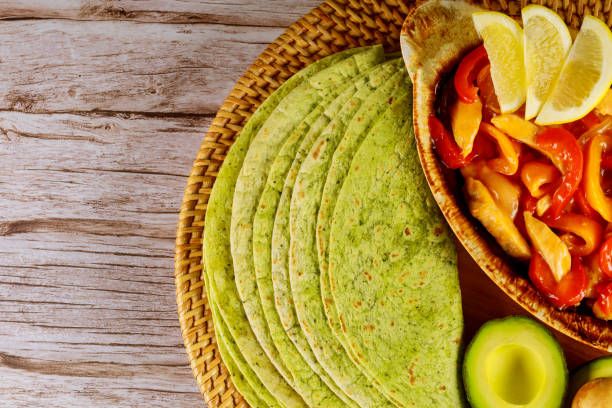 Spinach tortillas with fajita and avocado. Close up.