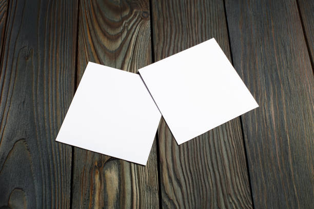 istock Two square blank cards on wood 1198642979