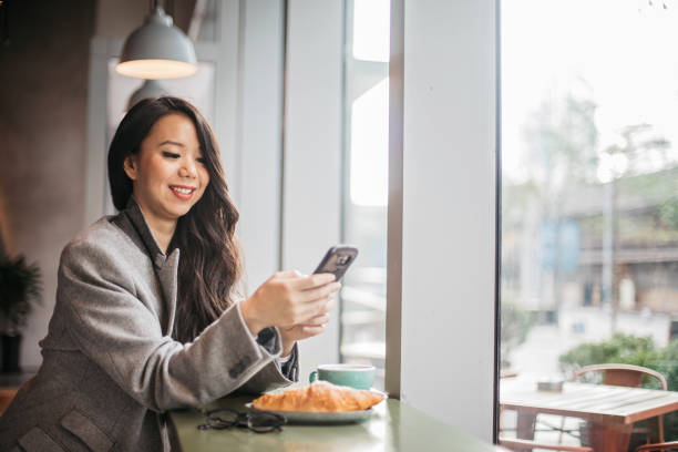 istock Pretty woman is using phone 1198644449