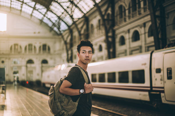 istock Young tourist on a train station 1198645382