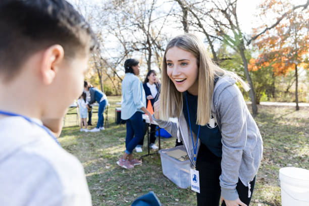 istock Young woman volunteering during charity event 1198645518