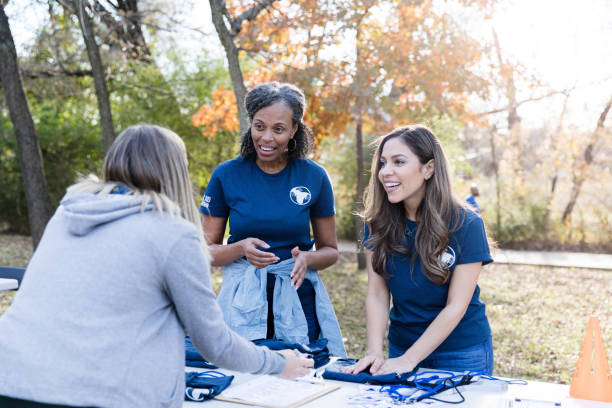 istock Volunteers register people during cleanup event 1198645557