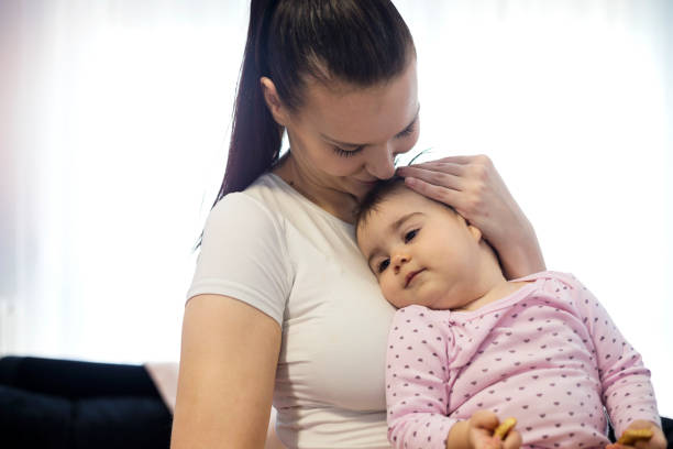 istock Mother holding her cute baby 1198646602