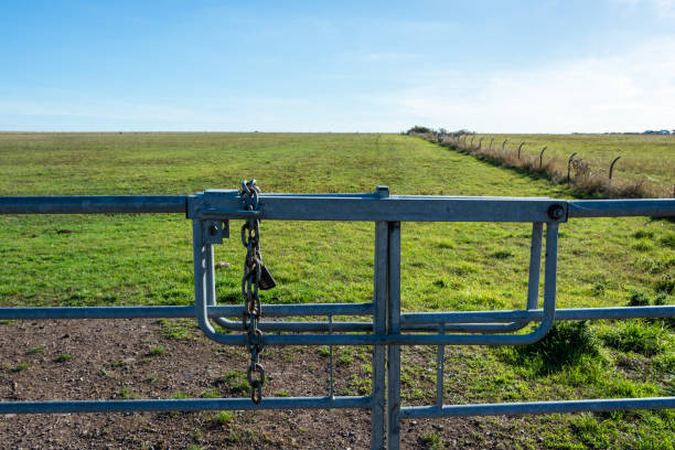 istock Metal gate to the vast grassland 1198646899