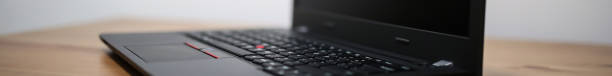 istock Red dot trackpoint cap on laptop qwerty keyboard and touchpad with buttons 1198649153