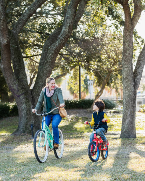 istock Hispanic boy and mother riding bikes 1198649568