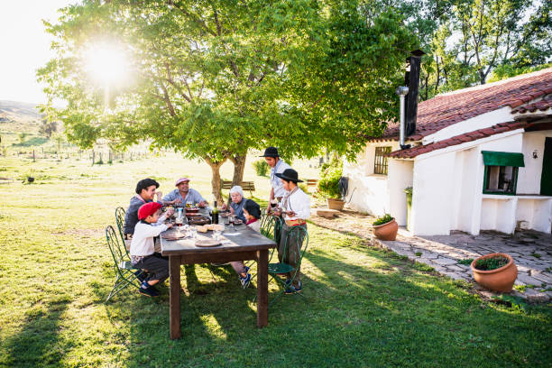 istock Senior Hispanic woman dining outdoors with gauchos 1198650279