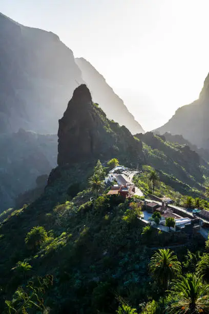 Spain, Tenerife, Cliffy, rocky green mountains of mountain village masca and canyon, aerial view above
