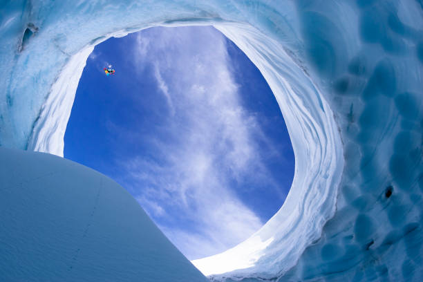 istock Snowboarder jumping into a crevasse. 1198650449