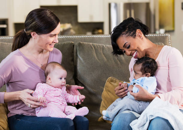 istock Two new mothers and their babies 1198650559