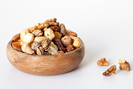dried fruits with nuts in wooden bowl
